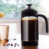 imageOVENTE French Press Coffee Maker 34 Ounce Heat Resistant Borosilicate Glass with 4 Filter StainlessSteel System BPAFree Portable Pitcher Perfect for Hot ampamp Cold Brew Red FPT34RFPB  Black