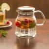 imageOvente Glass Teapot with High Grade Stainless Steel Infuser 27 Ounce with Free Measuring Scoop Heat Tempered Borosilicate Teapot Warmer with Leak and Spill Proof Technology Clear FGB27T