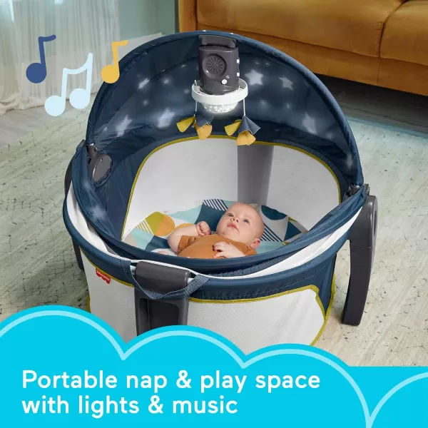 FisherPrice Baby Portable Baby Bassinet And Play Space Deluxe OnTheGo Projection Dome With Lights Music And CanopyPaper ShapesNavy