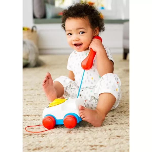 FisherPrice Toddler Pull Toy Chatter Telephone Pretend Phone with Rotary Dial and Wheels for Walking Play Ages 1 years