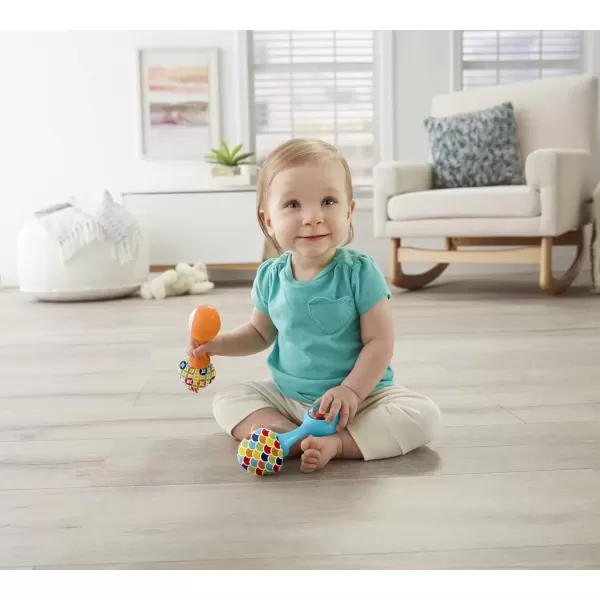 imageFisherPrice Newborn Toys Rattle n Rock Maracas 2 Soft Musical Instruments for Developmental Play Babies Ages 3 Months Pink ampamp PurpleBlueOrange