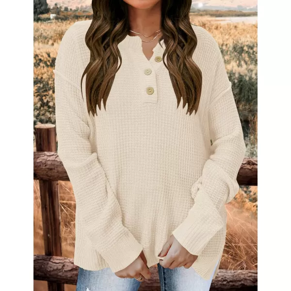 imageZESICA Womens 2023 Casual V Neck Sweater Loose Long Sleeve Waffle Knit Button Henley Pullover Jumper TopApricot