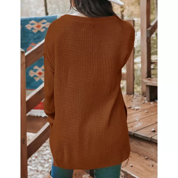 imageZESICA Womens 2023 Casual V Neck Sweater Loose Long Sleeve Waffle Knit Button Henley Pullover Jumper TopCaramel