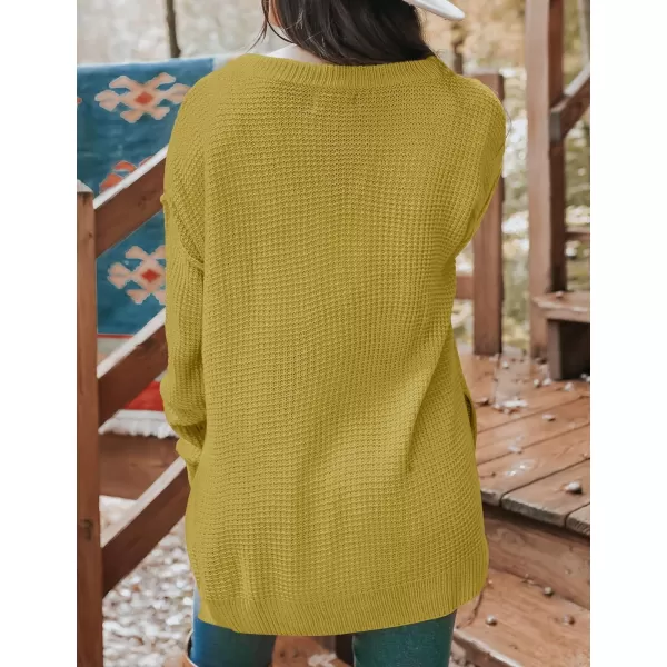imageZESICA Womens 2023 Casual V Neck Sweater Loose Long Sleeve Waffle Knit Button Henley Pullover Jumper TopMustard