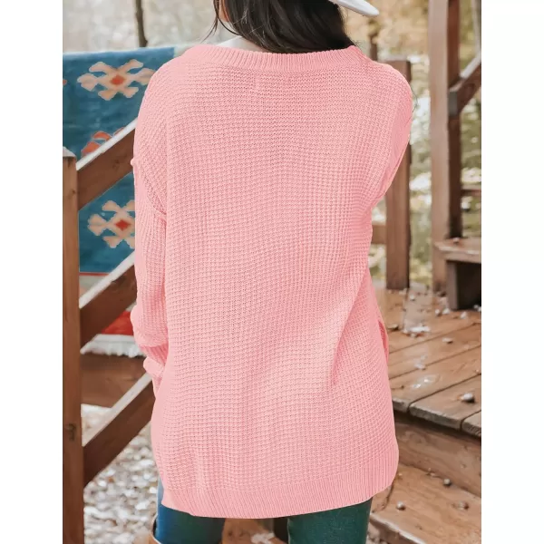 imageZESICA Womens 2023 Casual V Neck Sweater Loose Long Sleeve Waffle Knit Button Henley Pullover Jumper TopPink