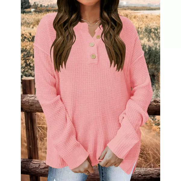 imageZESICA Womens 2023 Casual V Neck Sweater Loose Long Sleeve Waffle Knit Button Henley Pullover Jumper TopPink