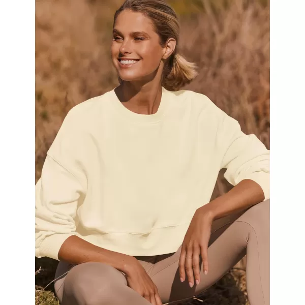 imageZESICA Womens 2023 Crop Sweatshirts Casual Long Sleeve Crewneck Solid Color Y2K Fleece Loose Pullover Sweatshirt TopsApricot