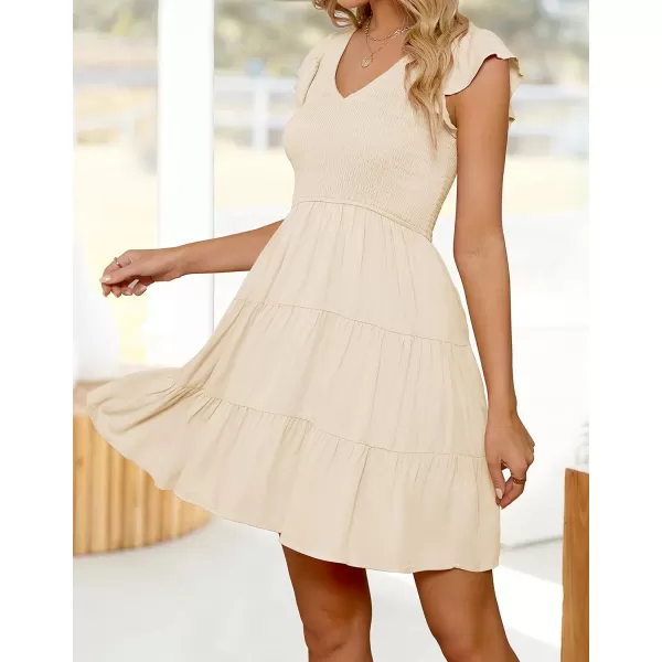 imageZESICA Womens 2023 Summer Casual V Neck Flutter Sleeve Bohemian Ruffle Smocked A Line Swing Mini DressBeige
