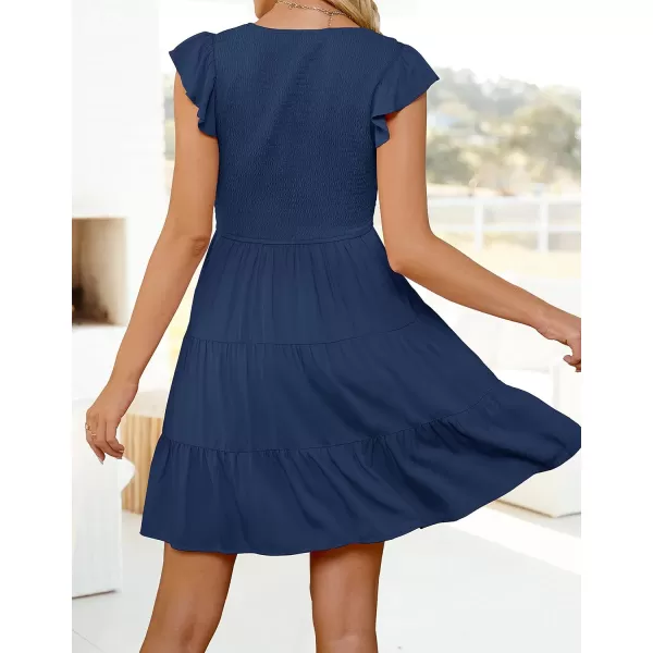 imageZESICA Womens 2023 Summer Casual V Neck Flutter Sleeve Bohemian Ruffle Smocked A Line Swing Mini DressNavy