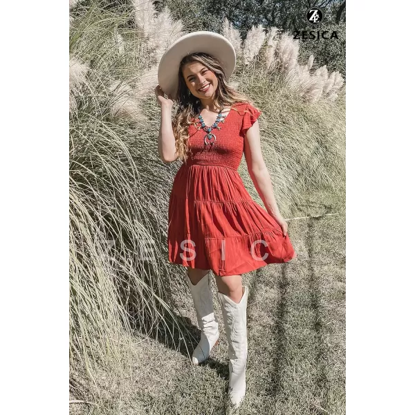 imageZESICA Womens 2023 Summer Casual V Neck Flutter Sleeve Bohemian Ruffle Smocked A Line Swing Mini DressRust