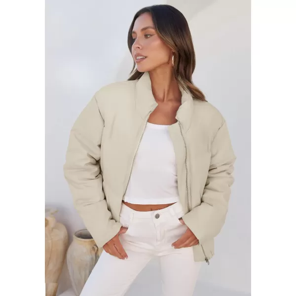 imageZESICA Womens Long Sleeve Cropped Puffer Jacket Winter Zipper Quilted Baggy Warm Short Down Coat Outwear with PocketsApricot