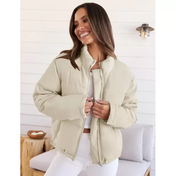 imageZESICA Womens Long Sleeve Cropped Puffer Jacket Winter Zipper Quilted Baggy Warm Short Down Coat Outwear with PocketsApricot