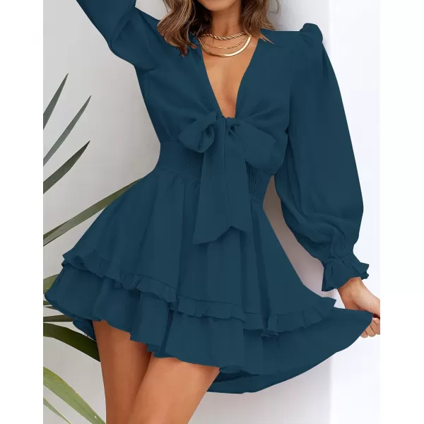 imageZESICA Womens Sexy Deep V Neck Knot Front Long Sleeve Smocked Wiast Ruffle Tiered Swing Mini Skater DressNavy