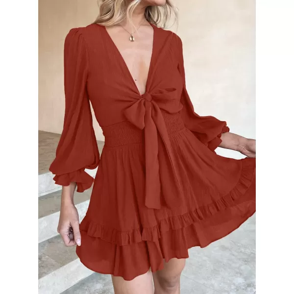 imageZESICA Womens Sexy Deep V Neck Knot Front Long Sleeve Smocked Wiast Ruffle Tiered Swing Mini Skater DressRust