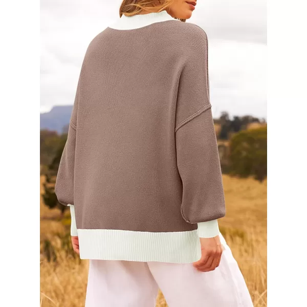 imageZESICA Womens Winter Oversized Sweaters Long Sleeve Color Block Mock Neck Side Slit Comfy Loose Knitted Pullover TopsAlmond