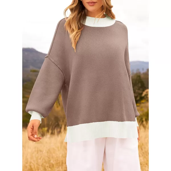 imageZESICA Womens Winter Oversized Sweaters Long Sleeve Color Block Mock Neck Side Slit Comfy Loose Knitted Pullover TopsAlmond