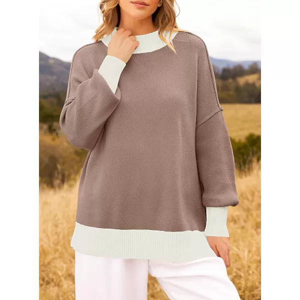 imageZESICA Womens Winter Oversized Sweaters Long Sleeve Color Block Mock Neck Side Slit Comfy Loose Knitted Pullover TopsAlmond