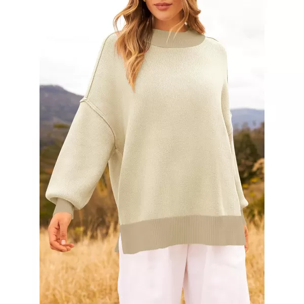 imageZESICA Womens Winter Oversized Sweaters Long Sleeve Color Block Mock Neck Side Slit Comfy Loose Knitted Pullover TopsApricot