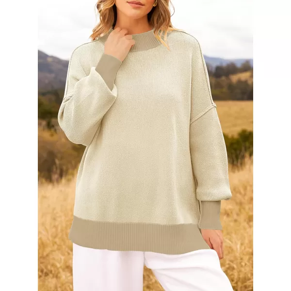 imageZESICA Womens Winter Oversized Sweaters Long Sleeve Color Block Mock Neck Side Slit Comfy Loose Knitted Pullover TopsApricot