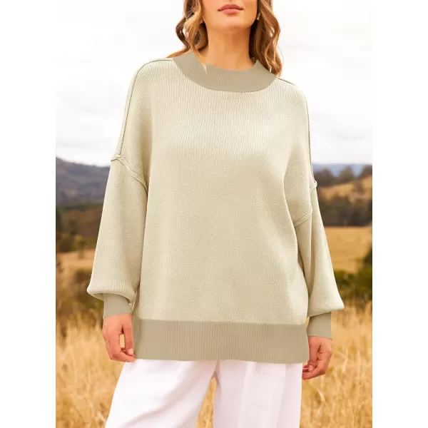 imageZESICA Womens Winter Oversized Sweaters Long Sleeve Color Block Mock Neck Side Slit Comfy Loose Knitted Pullover TopsApricot