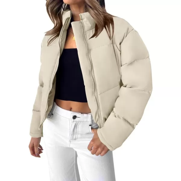imageZESICA Womens Long Sleeve Cropped Puffer Jacket Winter Zipper Quilted Baggy Warm Short Down Coat Outwear with PocketsApricot